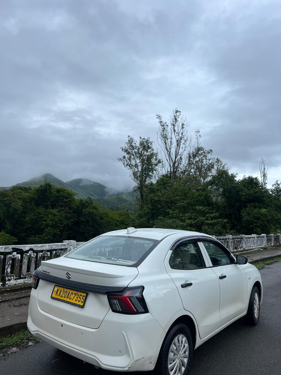 Swift Dzire Sedan parked on Scenic Western Ghats Bridge